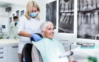 Beautiful senior woman receiving a dental treatment.
