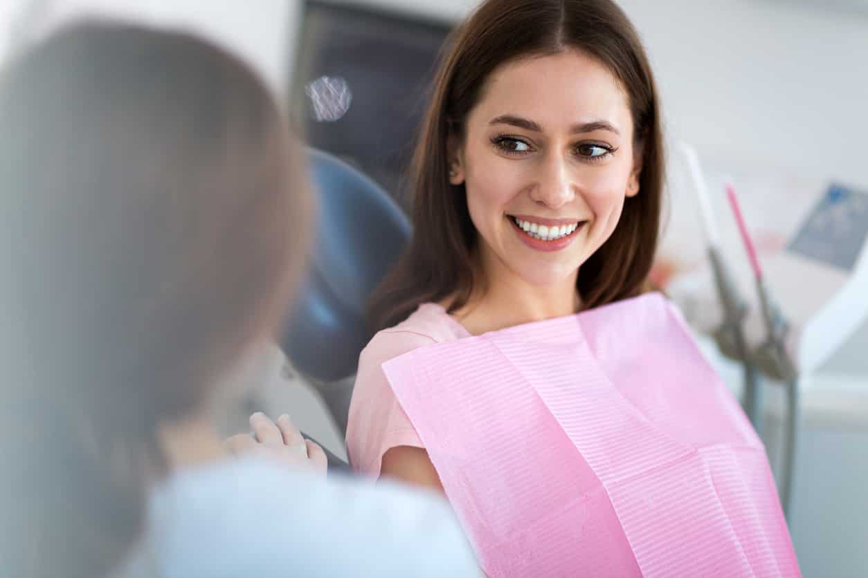 Dentist and patient in dentist office