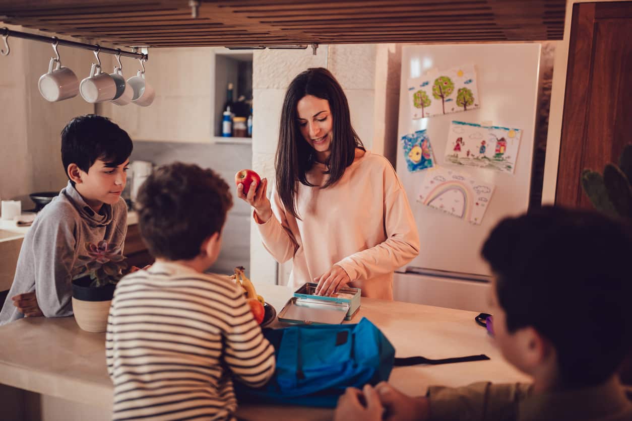 mother preparing healthy snacks for kids