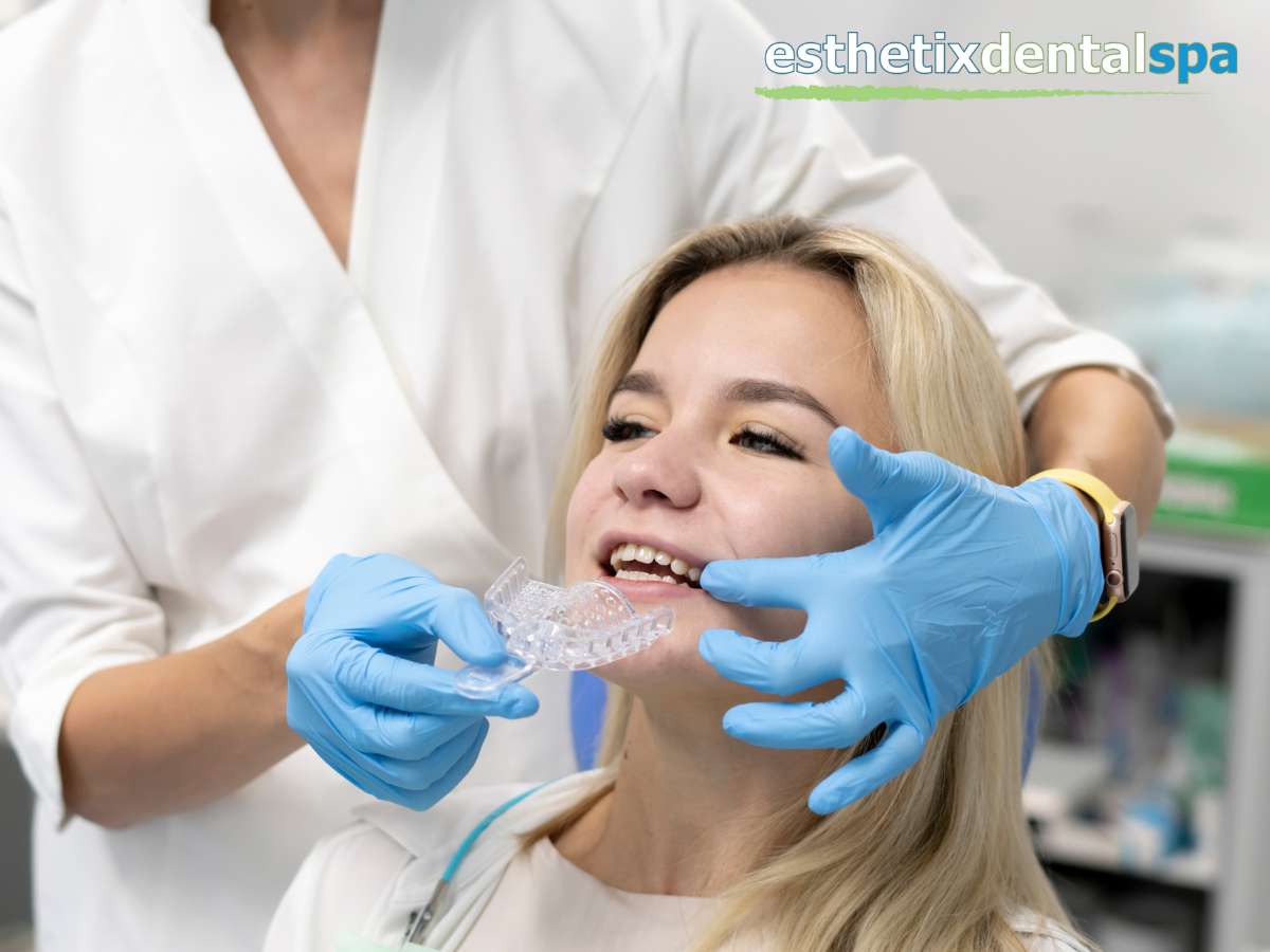 Dentist fitting Invisalign clear aligner for patient with crowded teeth