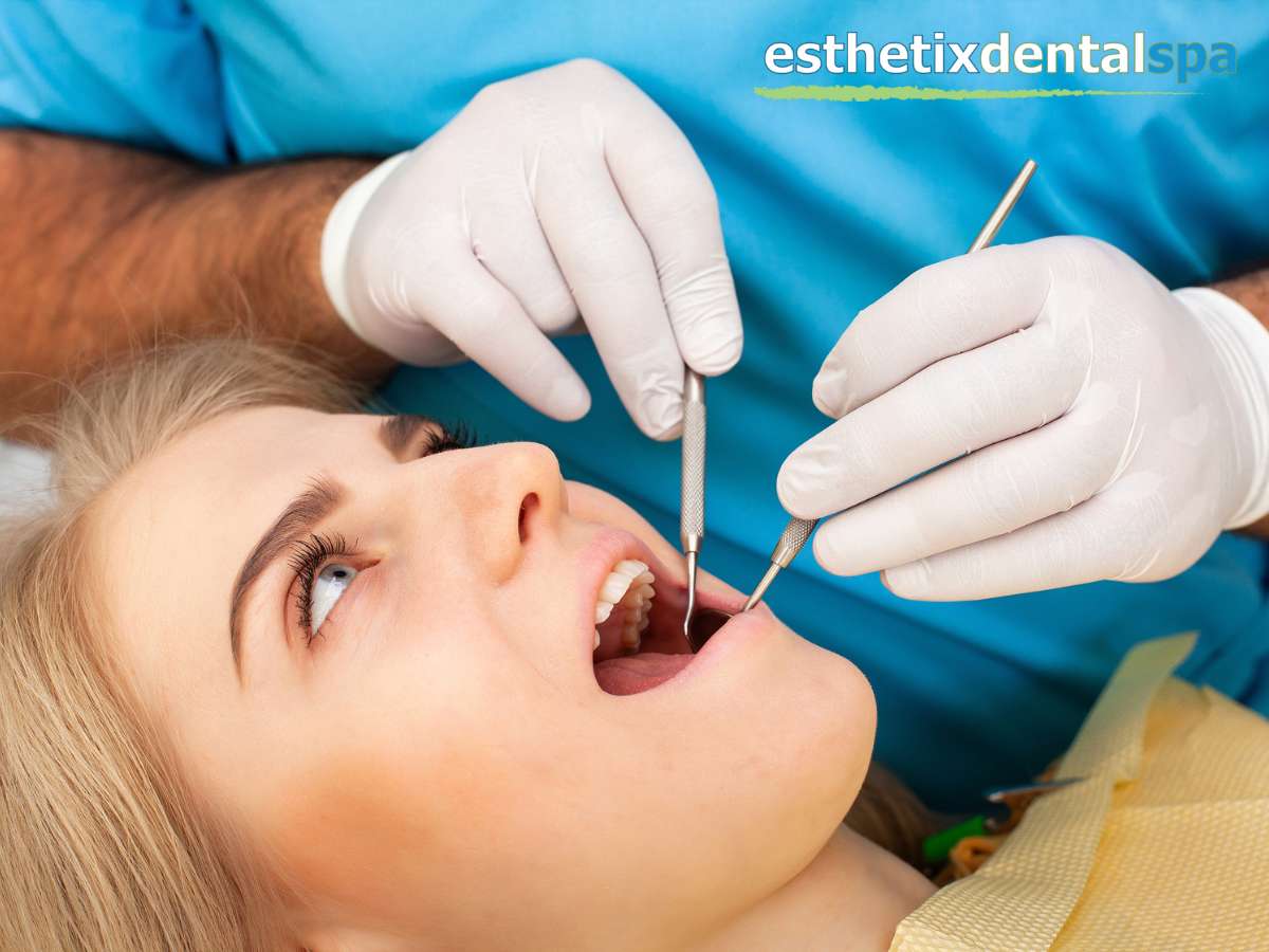 Dentist performing a tooth extraction on a patient in a dental clinic