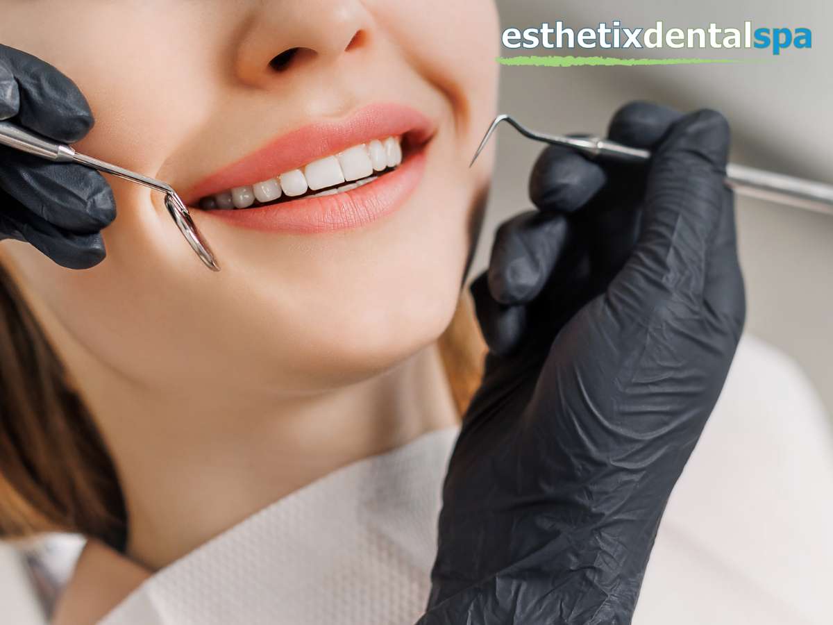 Dentist assessing a patient's smile during a porcelain crowns fitting