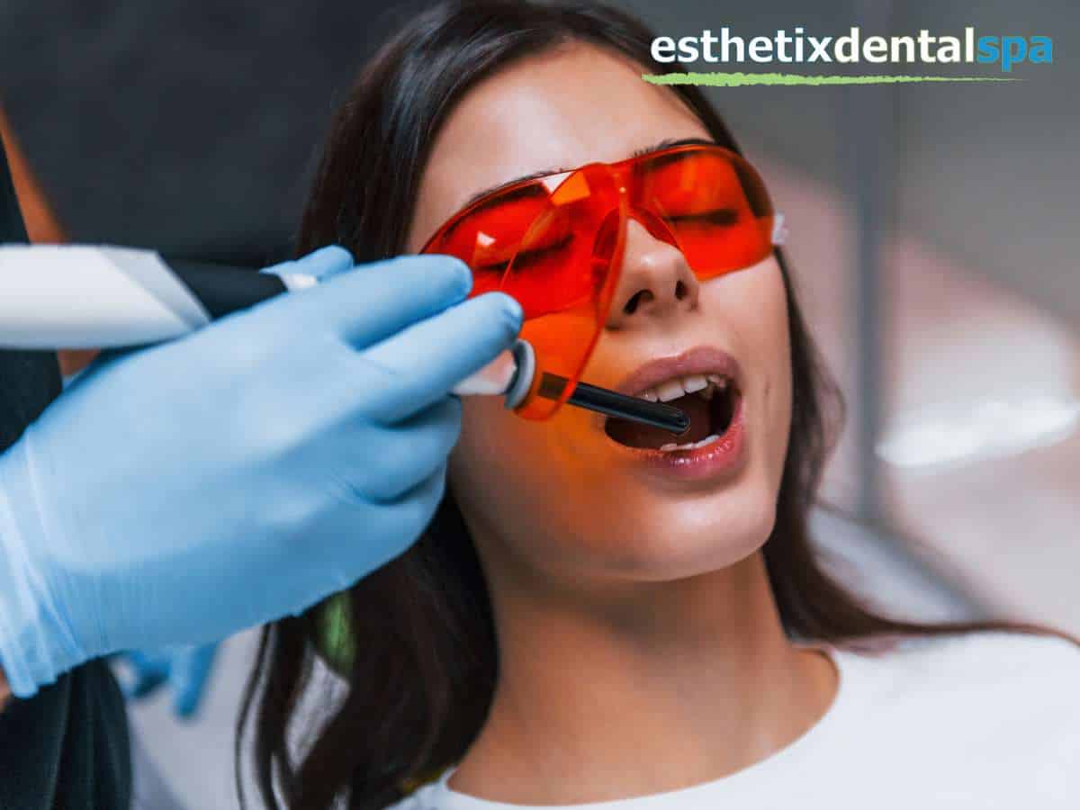 Patient receiving Laser Gum Disease Treatment at Esthetix Dental Spa for healthier gums.